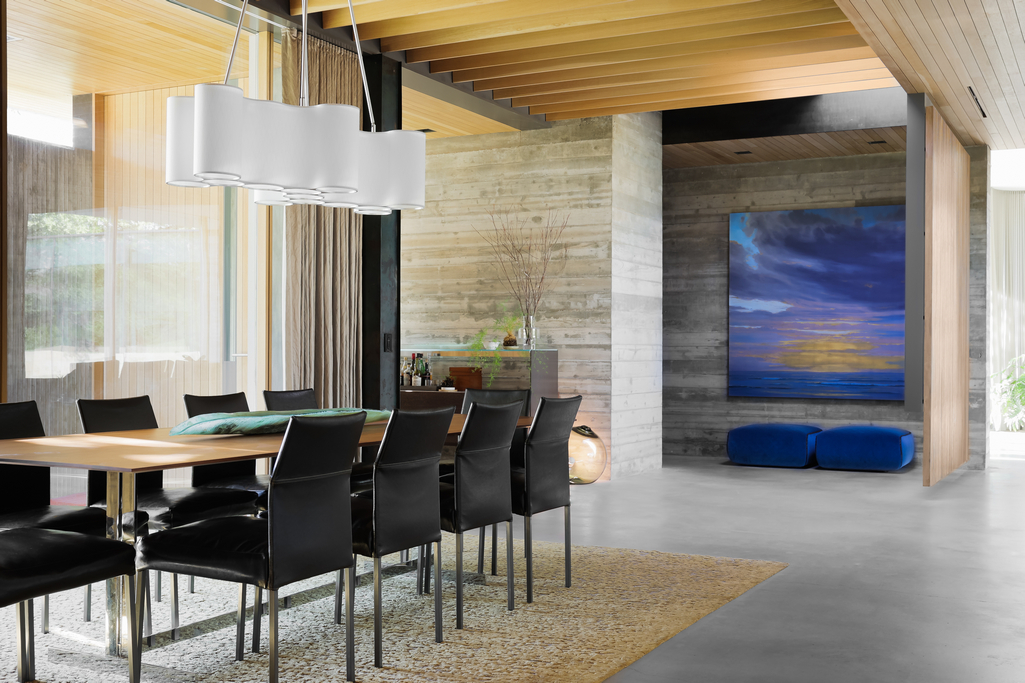 Contemporary Dining Room With Long Table And Black Chairs